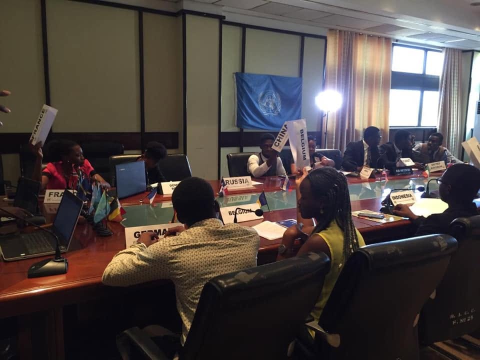Placards up for a vote: China, Belgium, and France signal the chair under the UN flag.