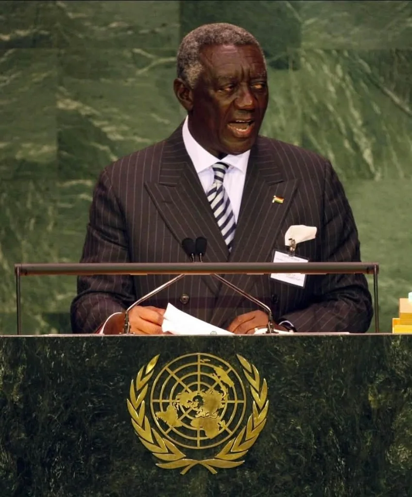 John Agyekum Kufuor, in a pinstriped suit, speaking at the General Assembly rostrum
