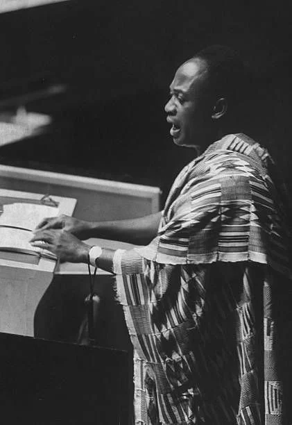 Kwame Nkrumah, wearing kente cloth, speaking at the rostrum of the United Nations General Assembly